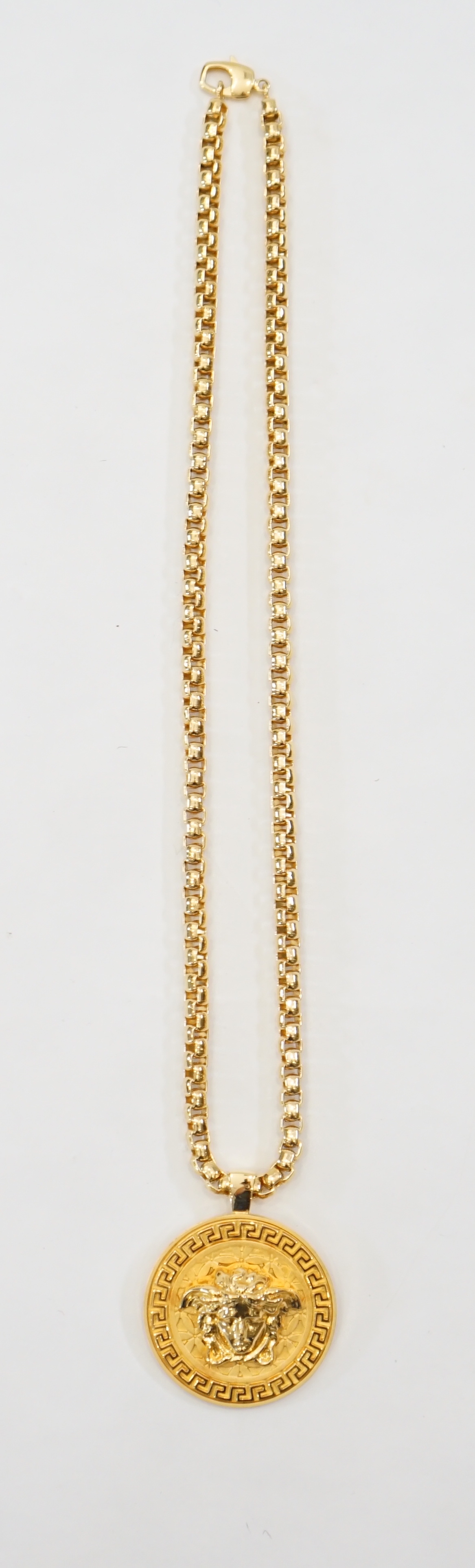 A Versace Medusa gold Greca medallion coin pendant with chunky rapper necklace, chain full length 64cm, medallion 5cm across